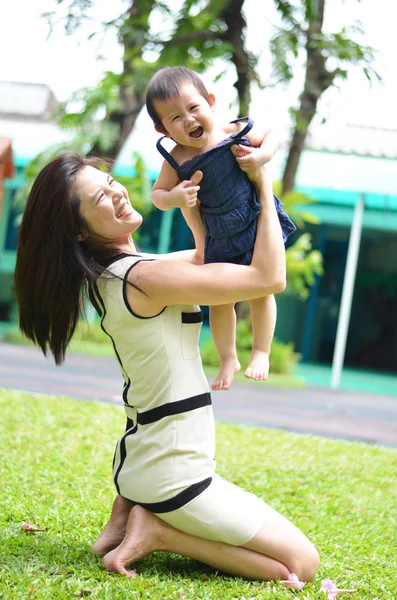 Mother holding baby  happy face