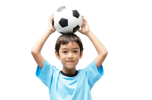 Niño sosteniendo el fútbol sobre fondo blanco — Foto de Stock