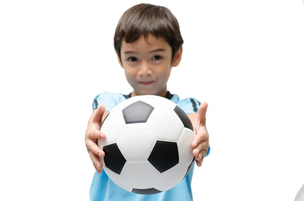 Menino segurando futebol no fundo branco — Fotografia de Stock