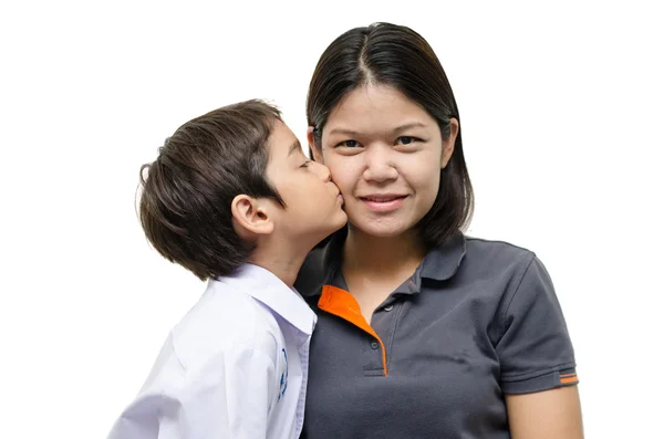 Little boy kissing mother on white background — Stock Photo, Image