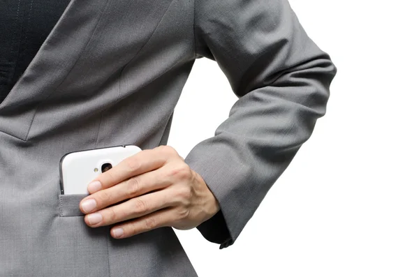 Kvinna hand plocka upp mobiltelefon från kostym pocket — Stockfoto