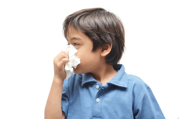 Menino doente com tecido no fundo branco — Fotografia de Stock