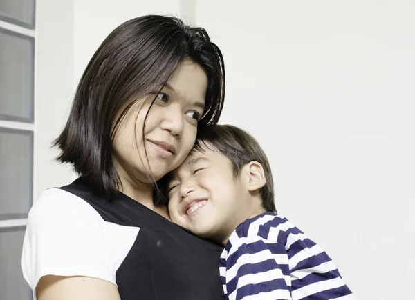 Little boy on mothrchess holding — Stock Photo, Image