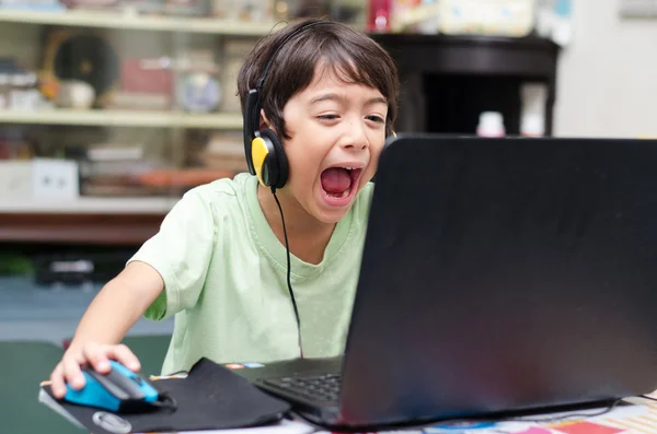 Little boy playing pc game at home — Stock Photo, Image