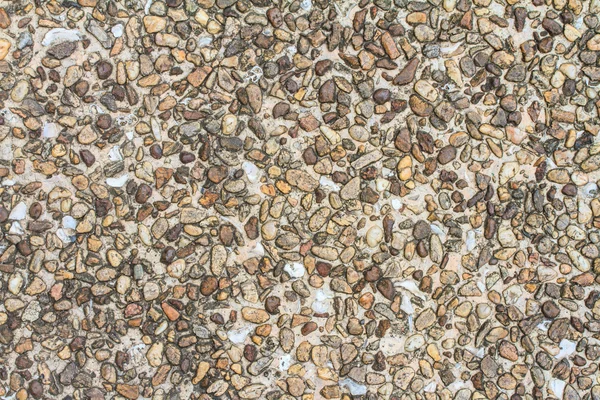 Стара цементна підлога покрита дрібним каменем — стокове фото