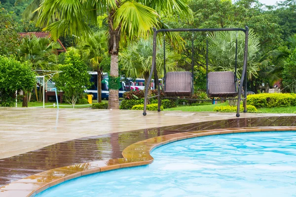 Swing next to the pool — Stock Photo, Image