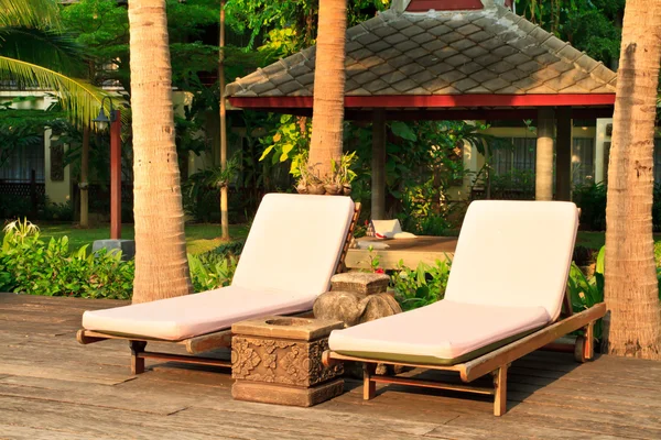 Spa chairs on pool deck — Stock Photo, Image