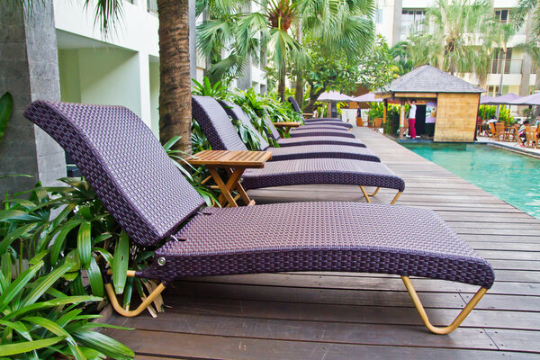 Spa chairs on wooden pool deck