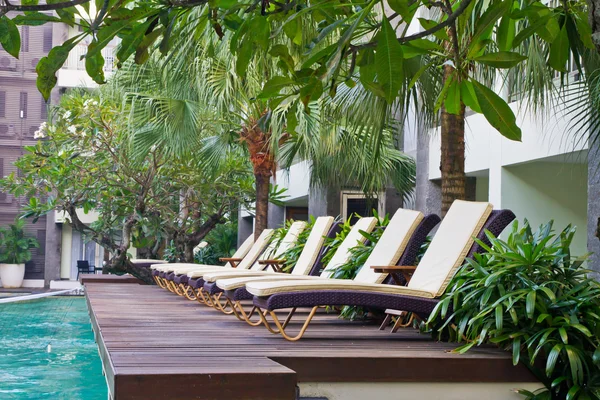 Spa chairs on wooden pool deck — Stock Photo, Image