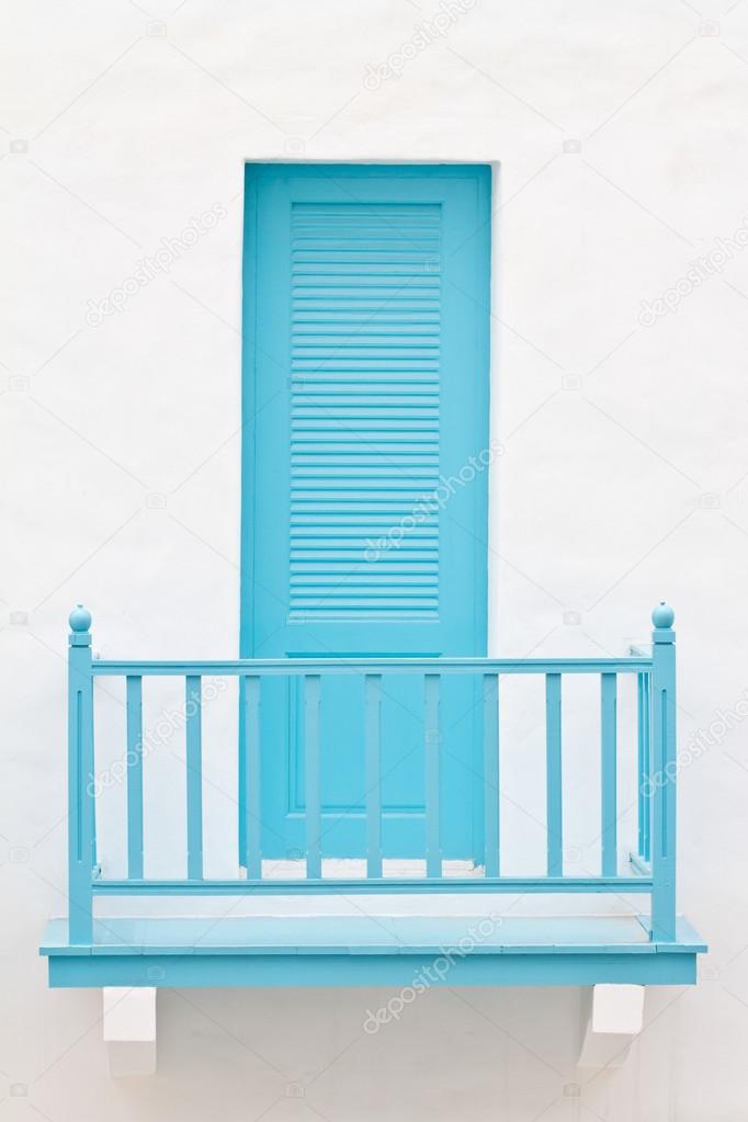 Blue door on white house