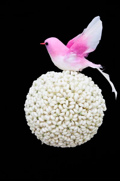 Flower ball and paper bird on white background — Stock Photo, Image