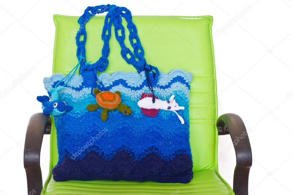 Crochet knitting bag on green chair