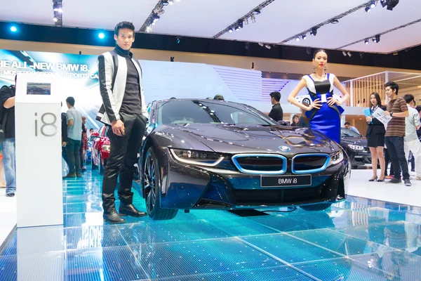 Unidentified modelling posted over BMW i8 — Stock Photo, Image