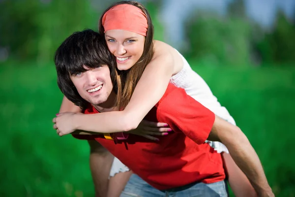 Girl and boy on green background — Stock Photo, Image