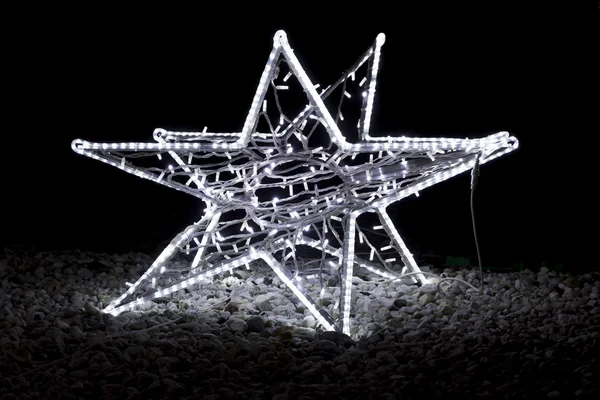 Christmas street decoration - star made of light bulbs fitted to — Stock Photo, Image