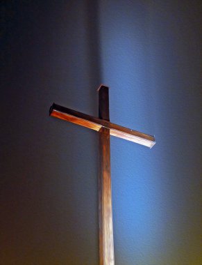 illuminated wooden christian cross in the background of night sk clipart