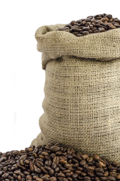 Wool bag full with coffee beans — Stock Photo, Image