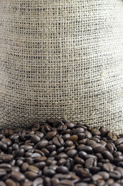 Wool bag full with coffee beans — Stock Photo, Image