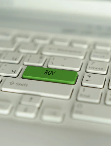 Notebook klavye düğme, finansal kavramı, borsa üzerinde yazılı satın.