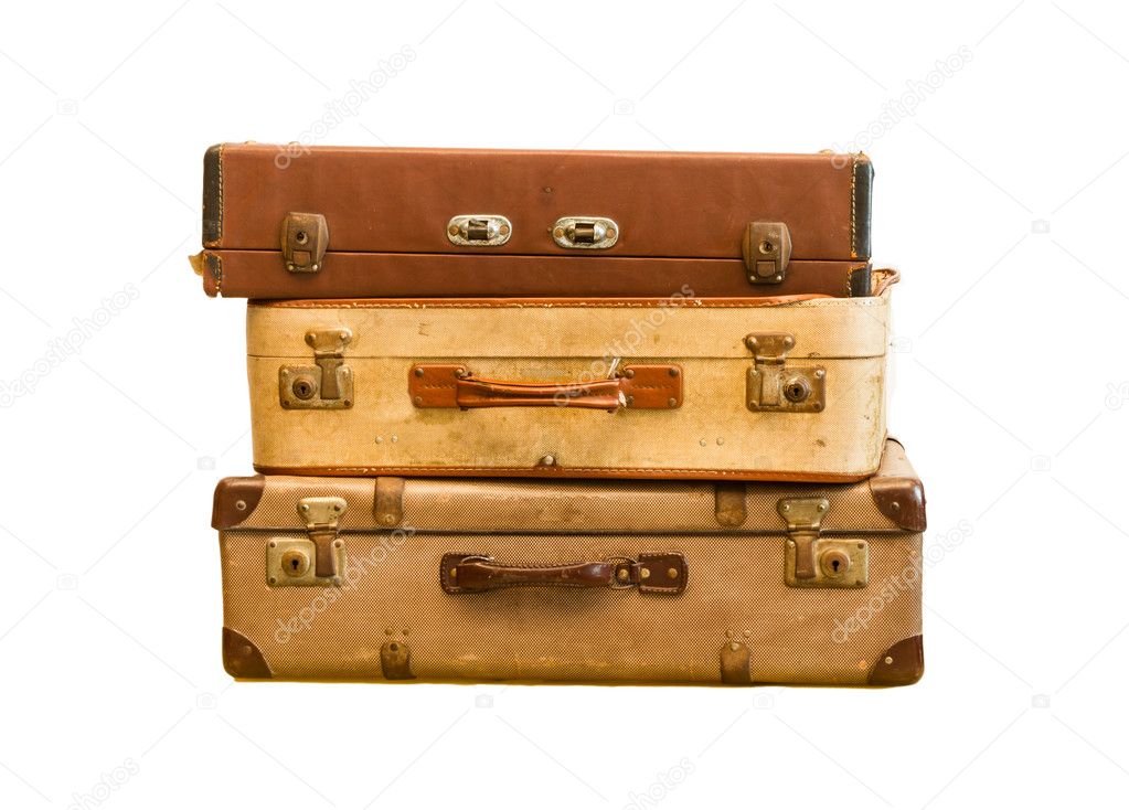Pile of old vintage bag suitcases on isolate background