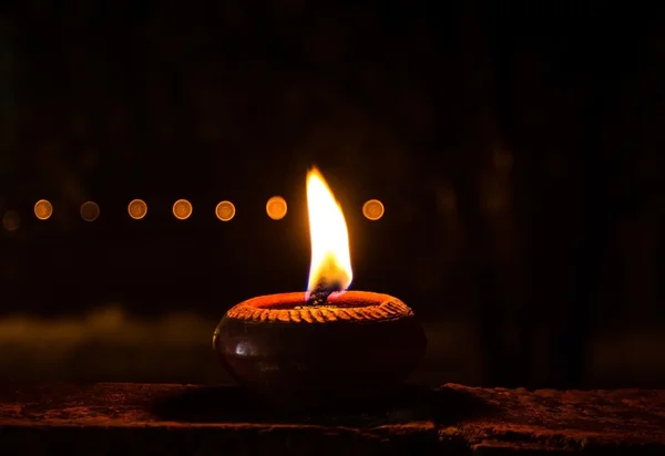 One candle flame at night — Stock Photo, Image