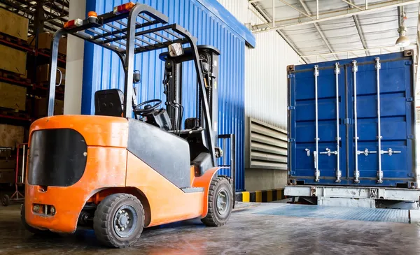 Forklift in warehouse with container — Stock Photo, Image