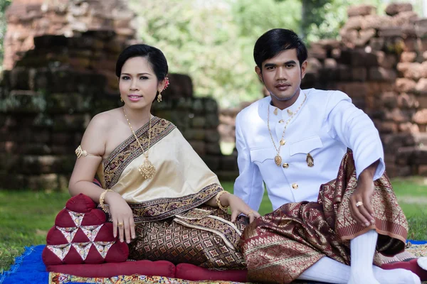 Thai man and woman in silk dress — Stock Photo, Image