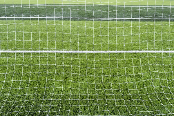 Goal net with green grass field. — Stock Photo, Image