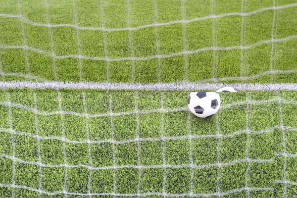 Soccer ball in goal — Stock Photo, Image