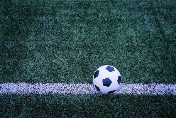 Soccer ball on soccer field — Stock Photo, Image