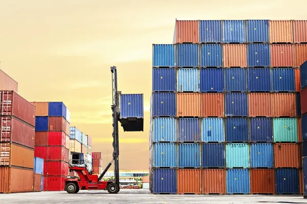 Forklift handling the container box at dockyard — Stock Photo, Image