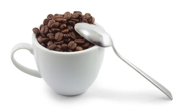 Fincan kahve çekirdekleri ve kaşık ile — Stok fotoğraf
