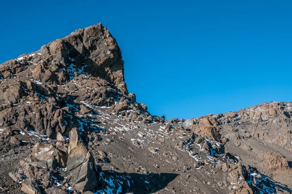 Trekkers vender tilbage til Gilmans Point Kilimanjaro - Stock-foto