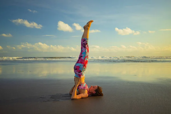 Beach Yoga Slim Caucasian Woman Practicing Sarvangasana Shoulder Stand Pose — стоковое фото