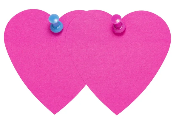 Çift kalp yapışkan etiket, pembe beyaz zemin üzerine izole mavi bir PIN — Stok fotoğraf