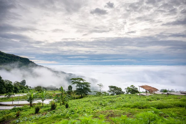 Thai bamboo bed for relaxation overlooking the clouds and mist in the morning. Phu Thap Berk, Phetchabun, in Thailand.