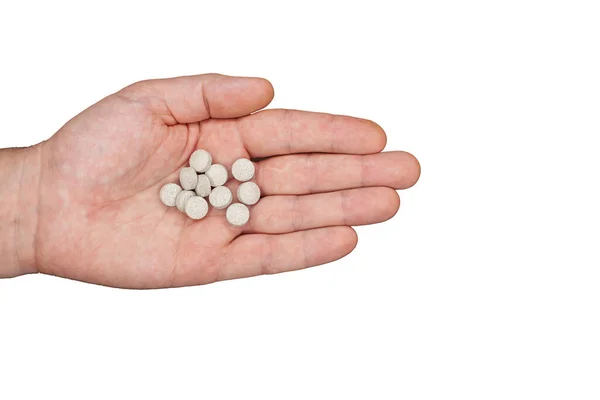Male hand holding pills. Capsules are white. Medicines. Isolate Royalty Free Stock Photos