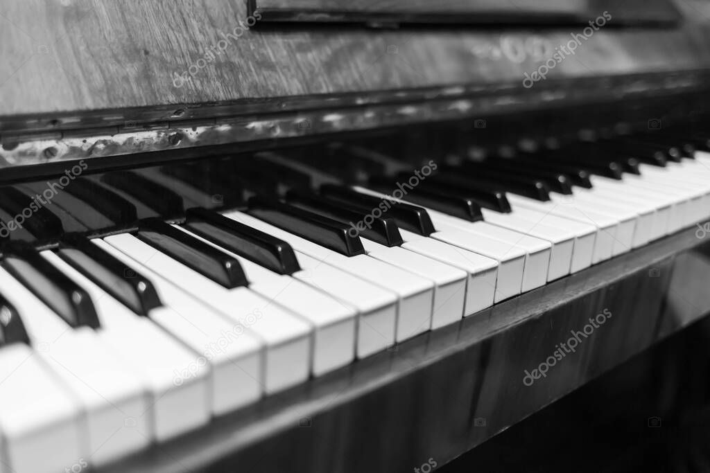 Piano keys closeup. Musical instrument in black and white photo.