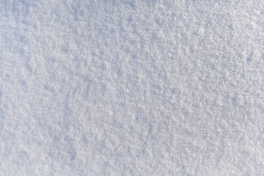 Temiz, beyaz kar yakın plan. Kış dönemi. Kar yüzeyi. Taze pofuduk kar dokusu. Beyaz kar taneleri. Yüksek kalite fotoğraf