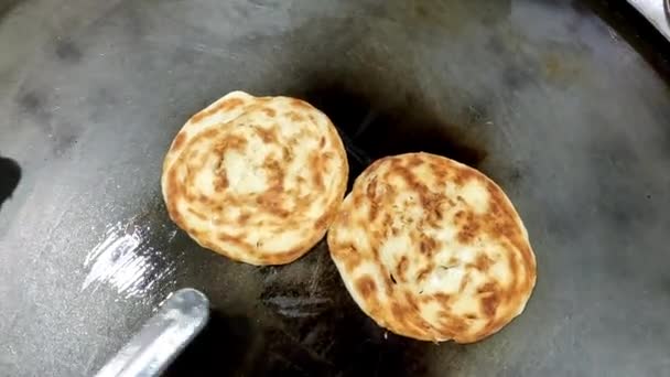 Street Food Vendor Preparing Dough Pan Frying Paratha Roti Hot — Stock Video