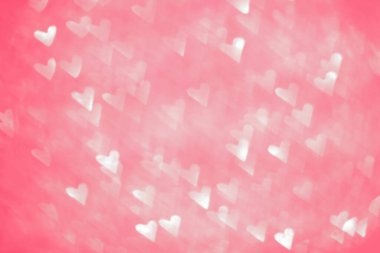 Pembe bulanık. Bokeh ve kalpleri olan bir arkaplan.