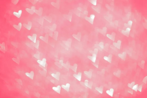 Roze wazig. Achtergrond met bokeh en harten. — Stockfoto