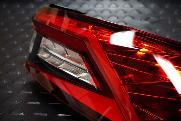 The taillight of a modern car. Selected focus. Auto parts and repair.