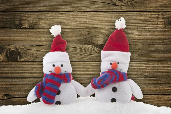 Snögubbe (leksak) på trä bakgrund — Stockfoto