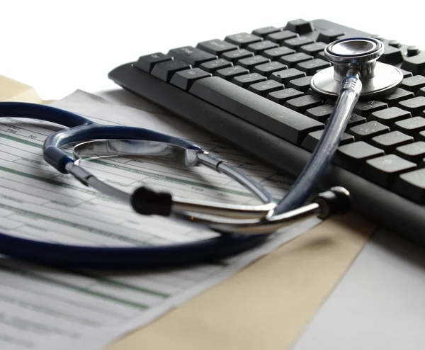 Stethoscope on a computer keyboard — Stock Photo, Image