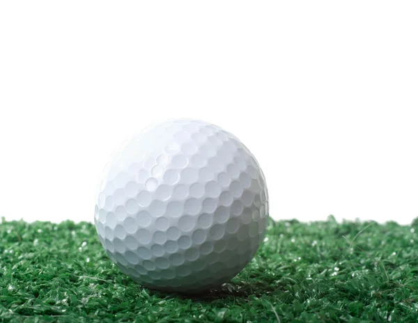 Golf ball ower green grass — Stock Photo, Image