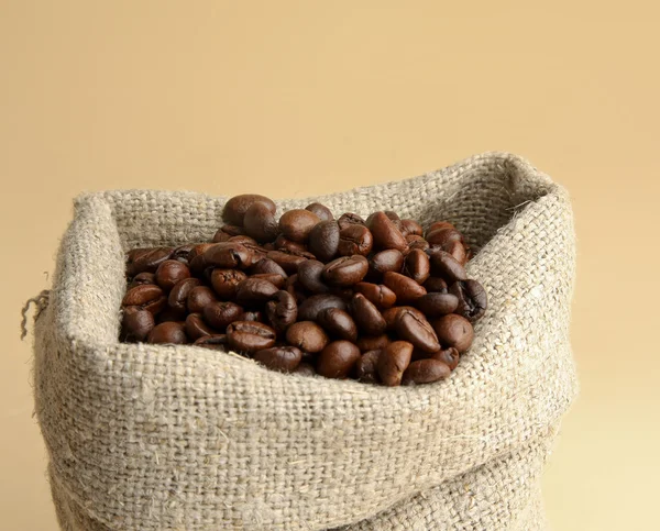 Coffee beans spilled out of the bag — Stock Photo, Image