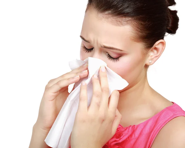 Sick woman blowing her nose Stock Photo