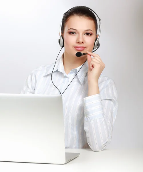 A smiling young customer service girl Stock Image