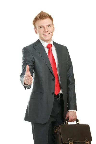 A young businessman giving his hand for a handshake — Stock Photo, Image